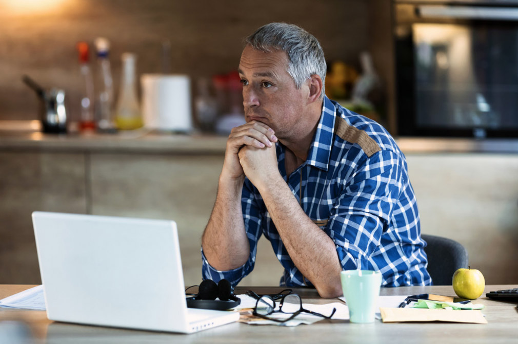 middle age man contemplating retiring early